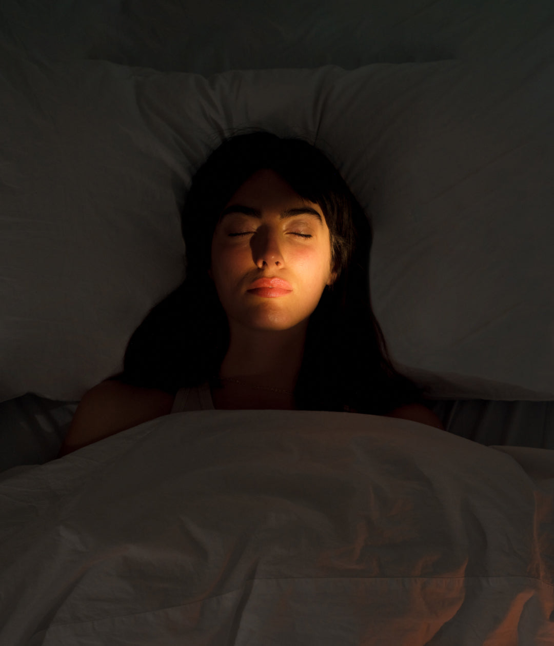 Woman on her phone in bed